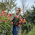 Ella cutting flowers at the flower farm