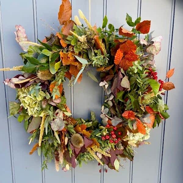 Autumn wreath of fresh and dried flowers