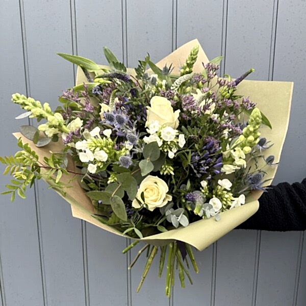 Blues bouquet filled with seasonal flowers in wrap